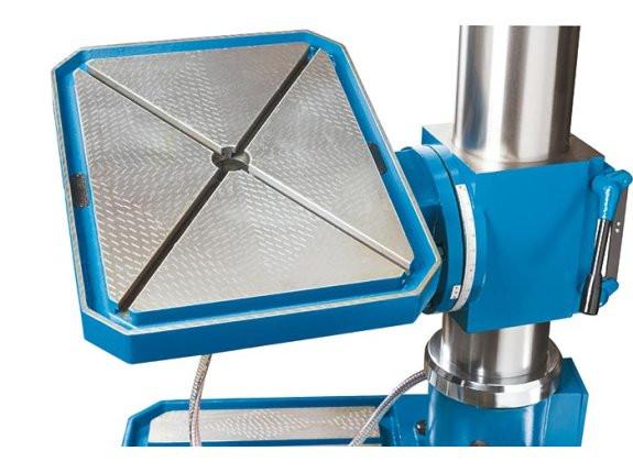 Drill press table with motorized travel and adjustable angle