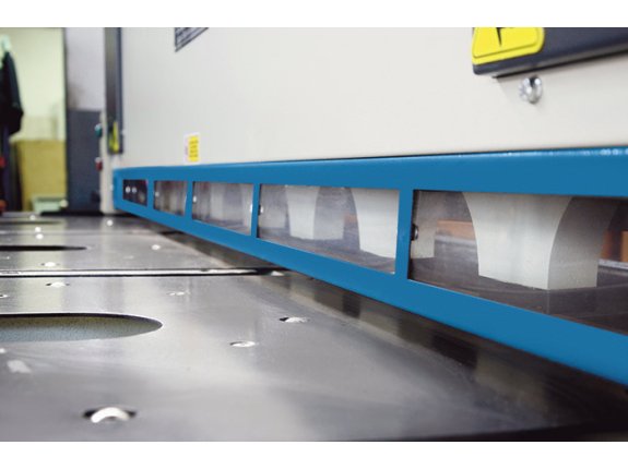 Material support rollers are recessed in the table for easy workpiece handling